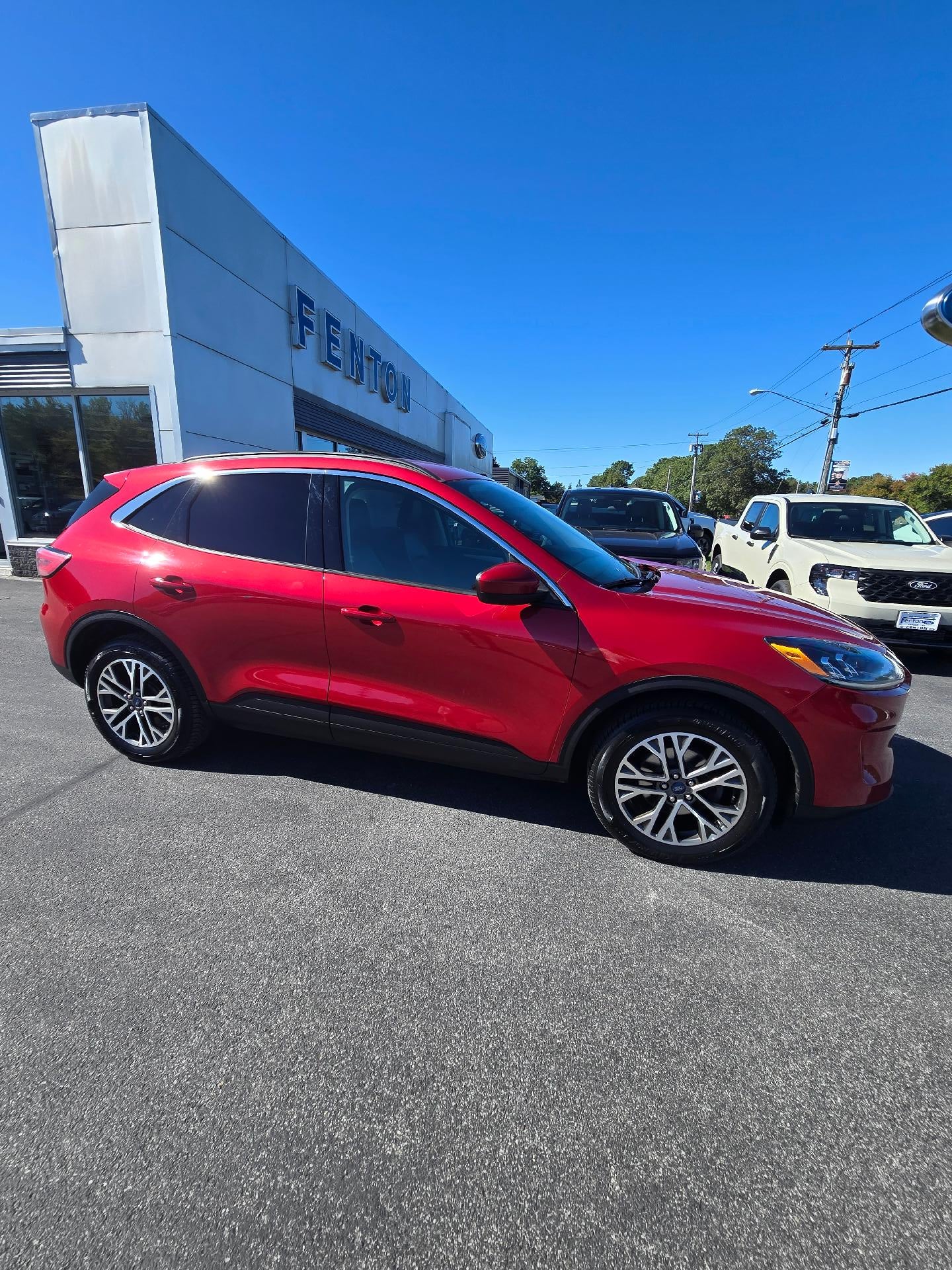2020 Ford Escape SEL AWD in Rapid Red Metallic Tinted Clearcoat — front three-quarter view