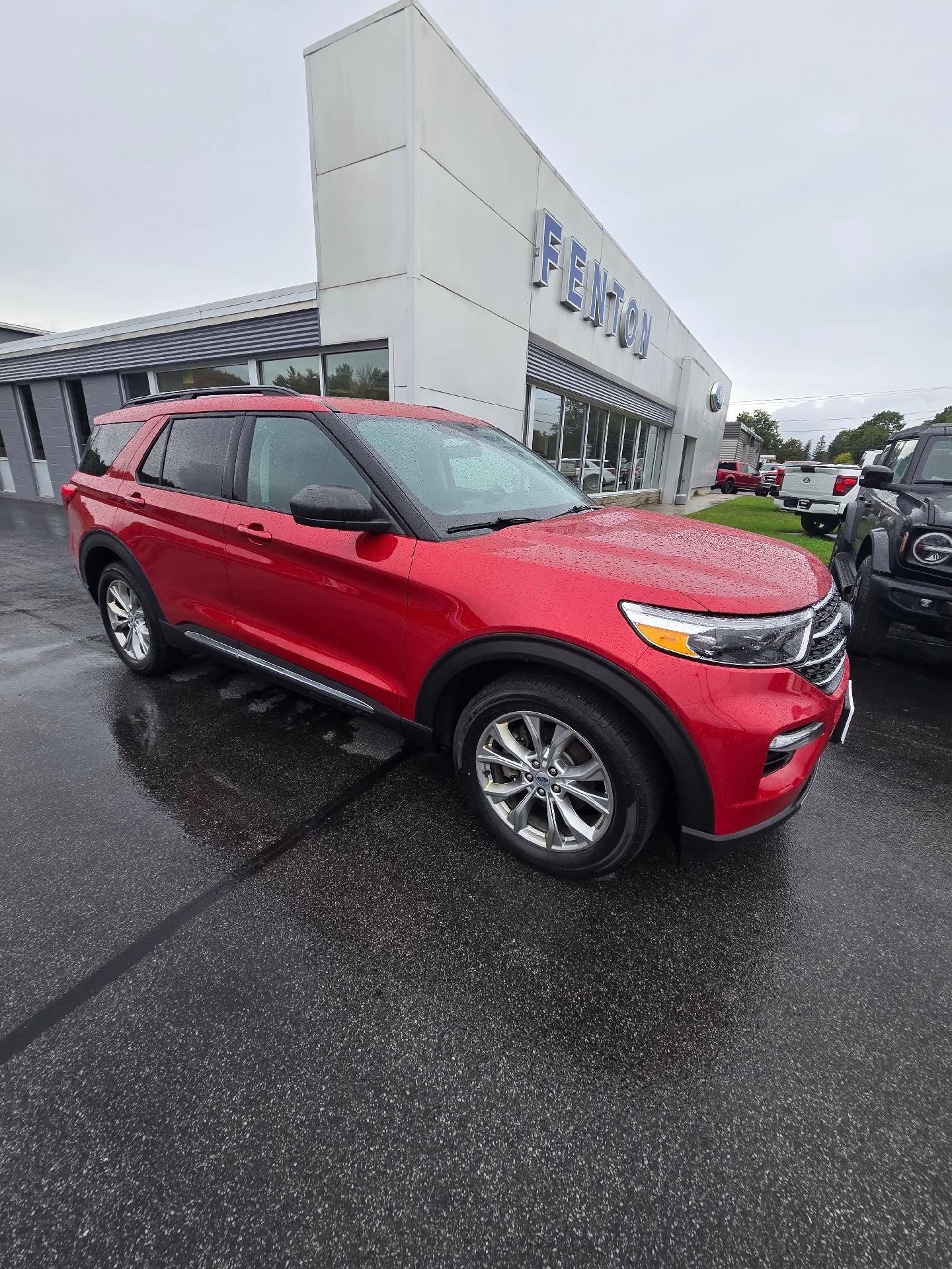 2021 Ford Explorer XLT 4WD in Rapid Red Metallic Tinted Clearcoat — front three-quarter view
