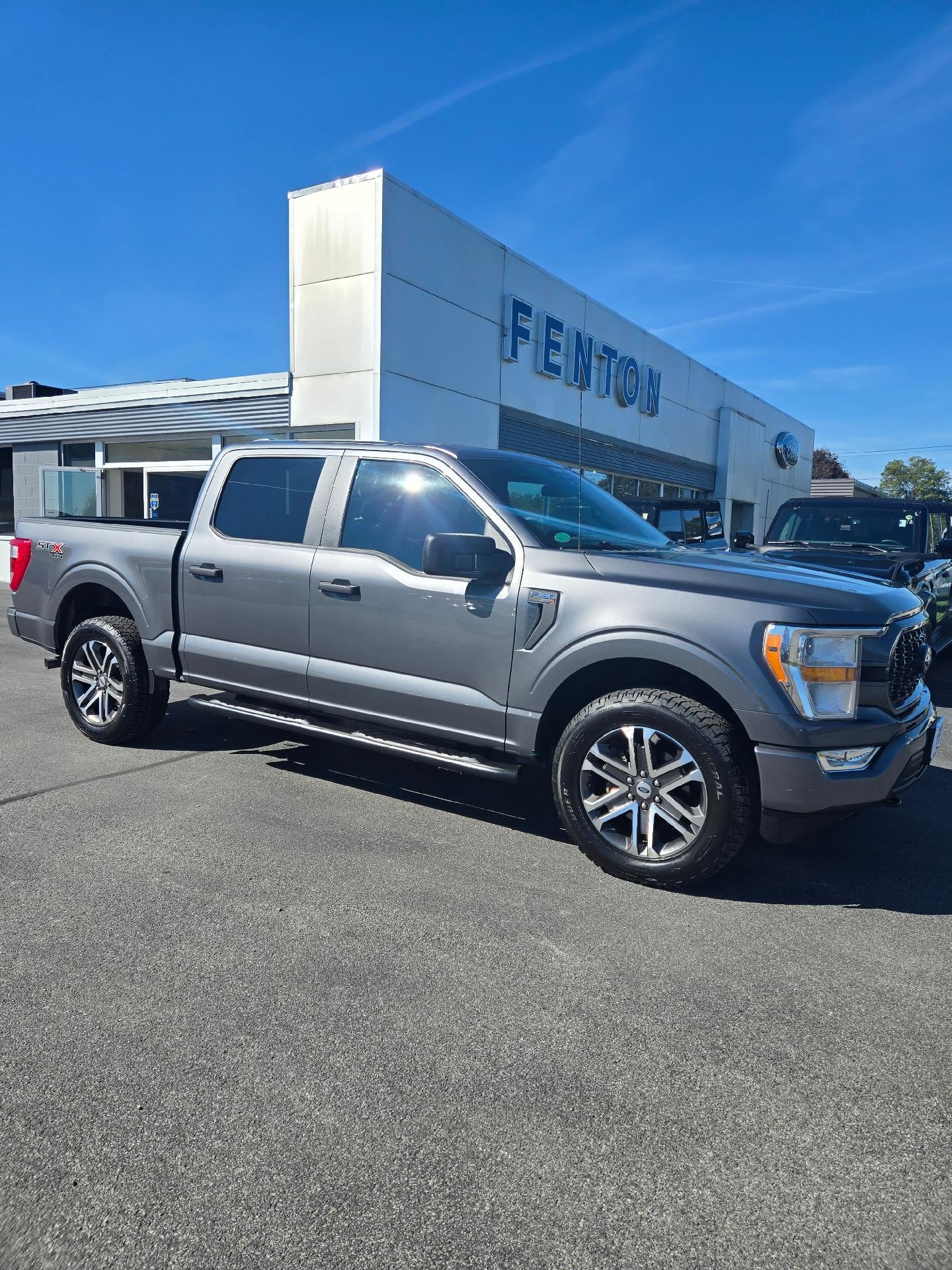 2022 Ford F-150 STX Crew Cab in Carbonized Gray Metallic — front three-quarter view